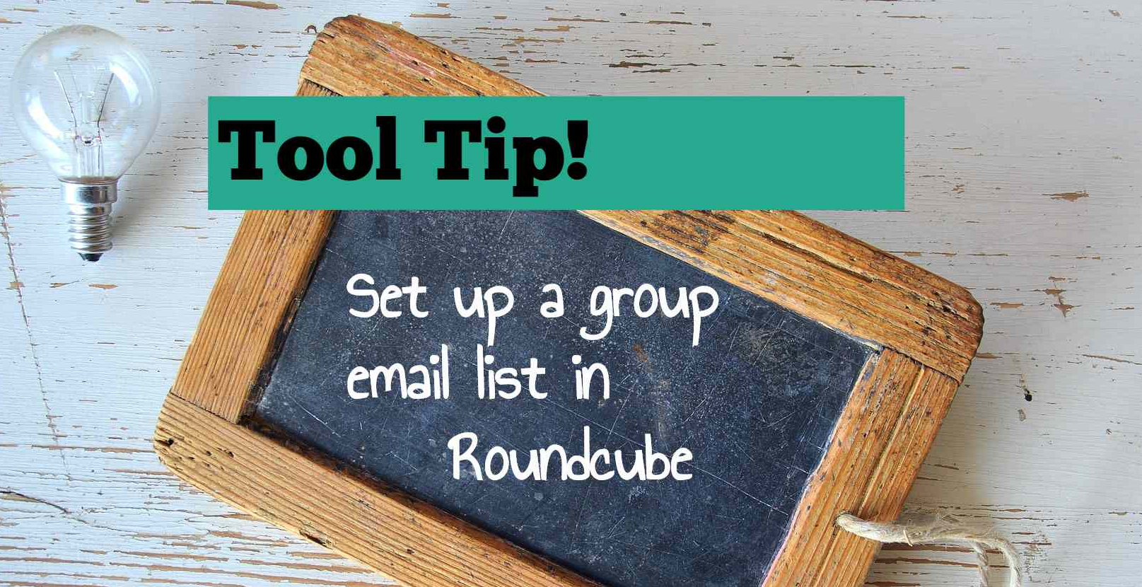 A small blackboard with the text, "Set up a group email list in Roundcube" written on it.