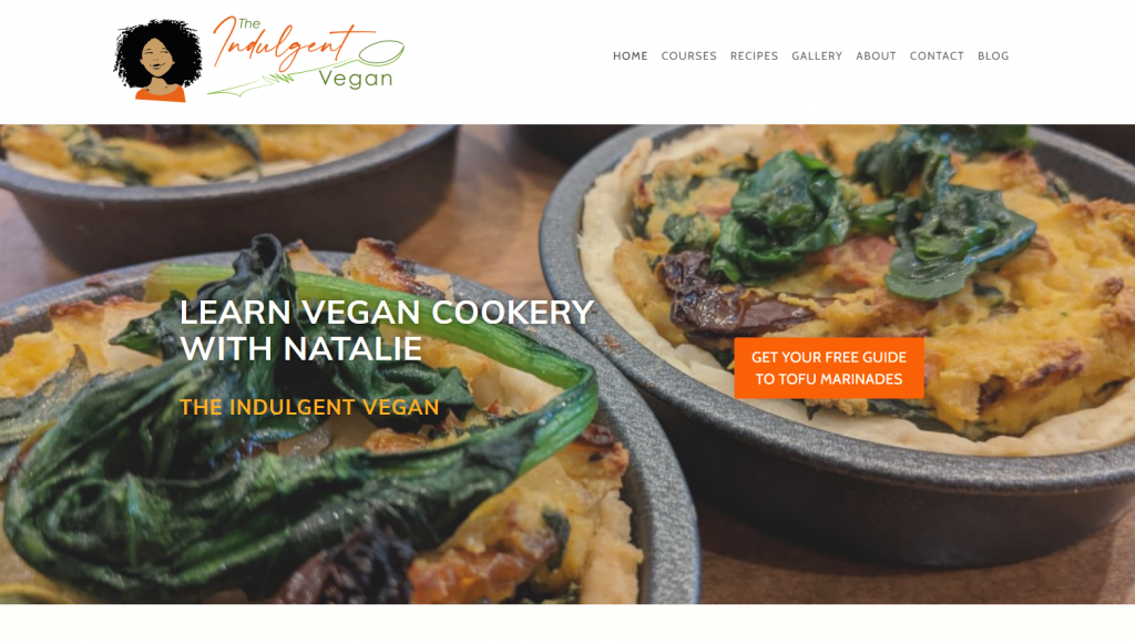 A screenshot of the logo, menu, and hero image for the Indulgent Vegan website